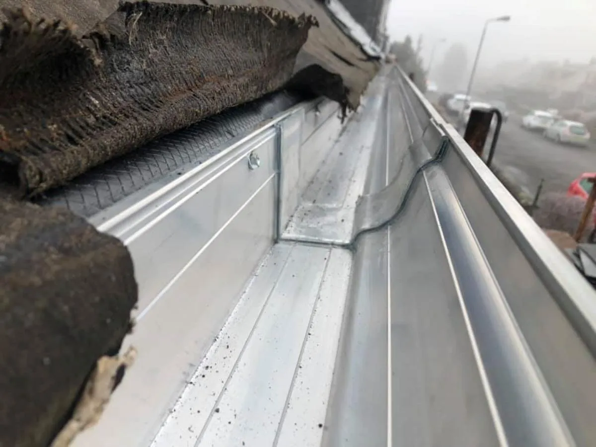 Close-up of new guttering bracket and fixing