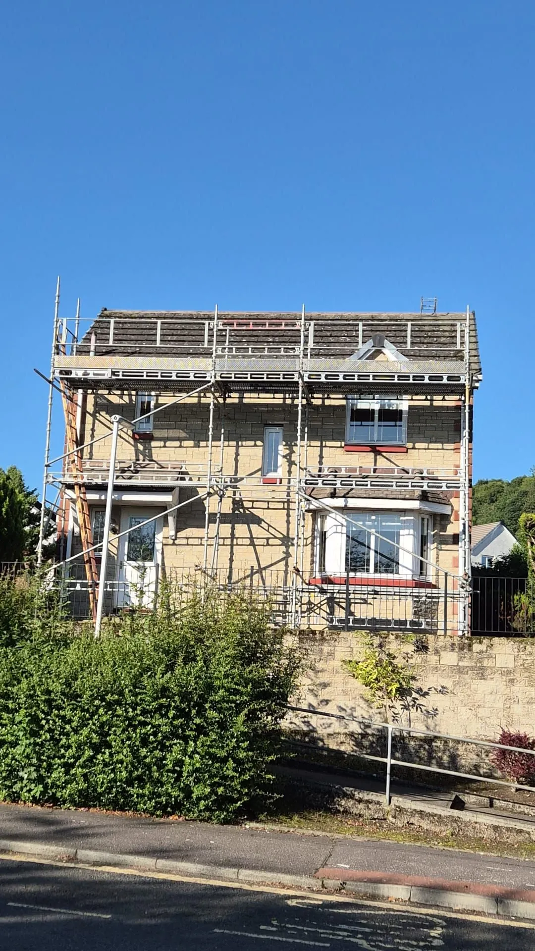 Scaffolding erected around a detached house in Dalgety Bay ready for a full roof replacement