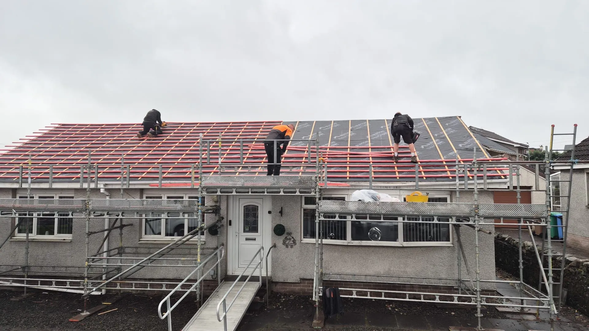 Breathable roofing membrane and treated battens fitted across a bungalow roof in Lochgelly