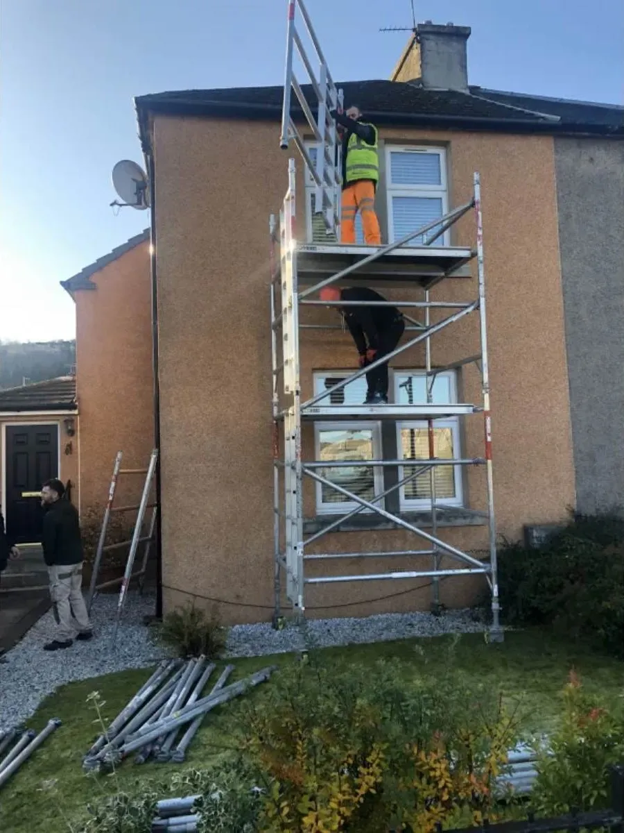 Forth Valley Roofing team working on fascias at a property in Alloa