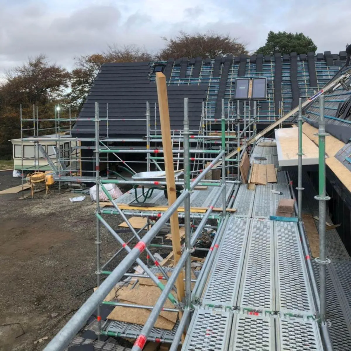 Slate dormer roof under construction with scaffolding in the Forth Valley
