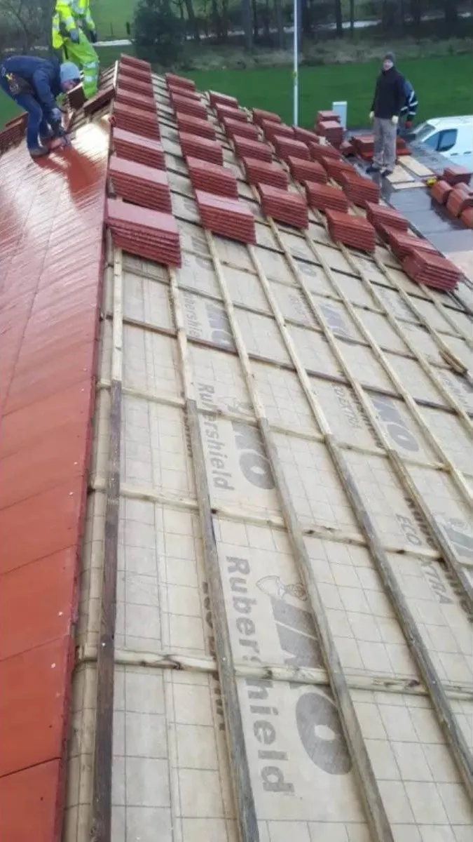 Tile roof being laid with membrane in Alloa